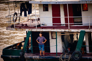 Chinese Fishman on his Steel Boat Tracy McCrackin Photography - Tracy McCrackin Photography