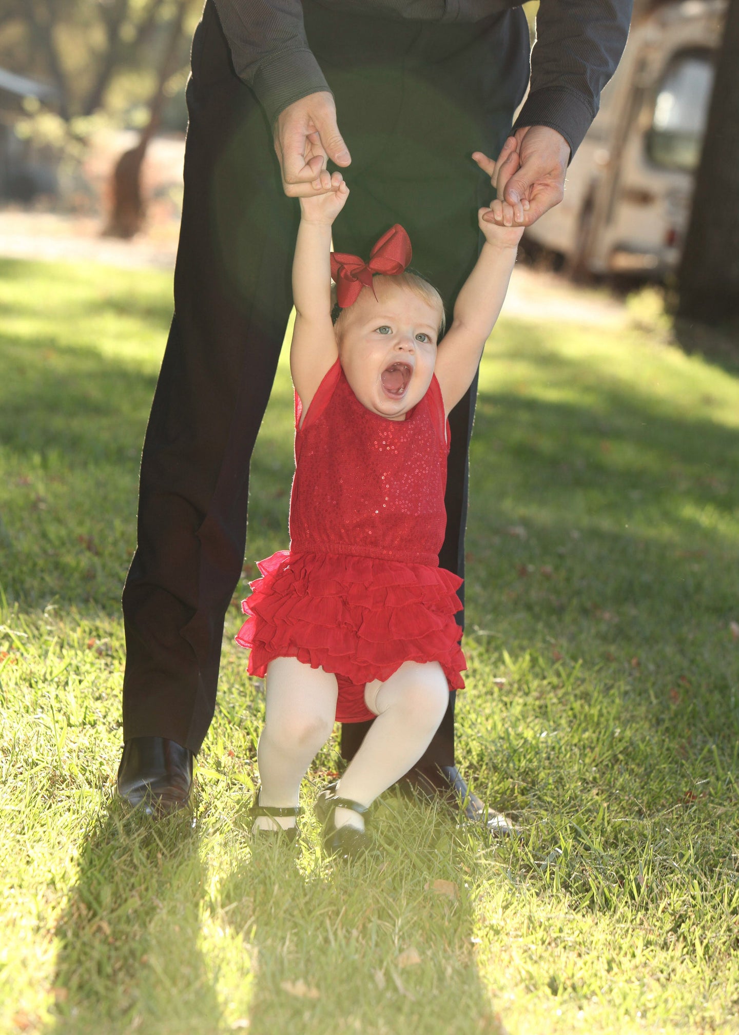 Child Swinging with Father Red Dress Tracy McCrackin Photography - Tracy McCrackin Photography