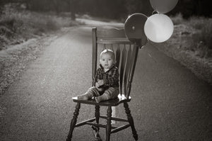 Birthday boy on a red chair Tracy McCrackin Photography - Tracy McCrackin Photography