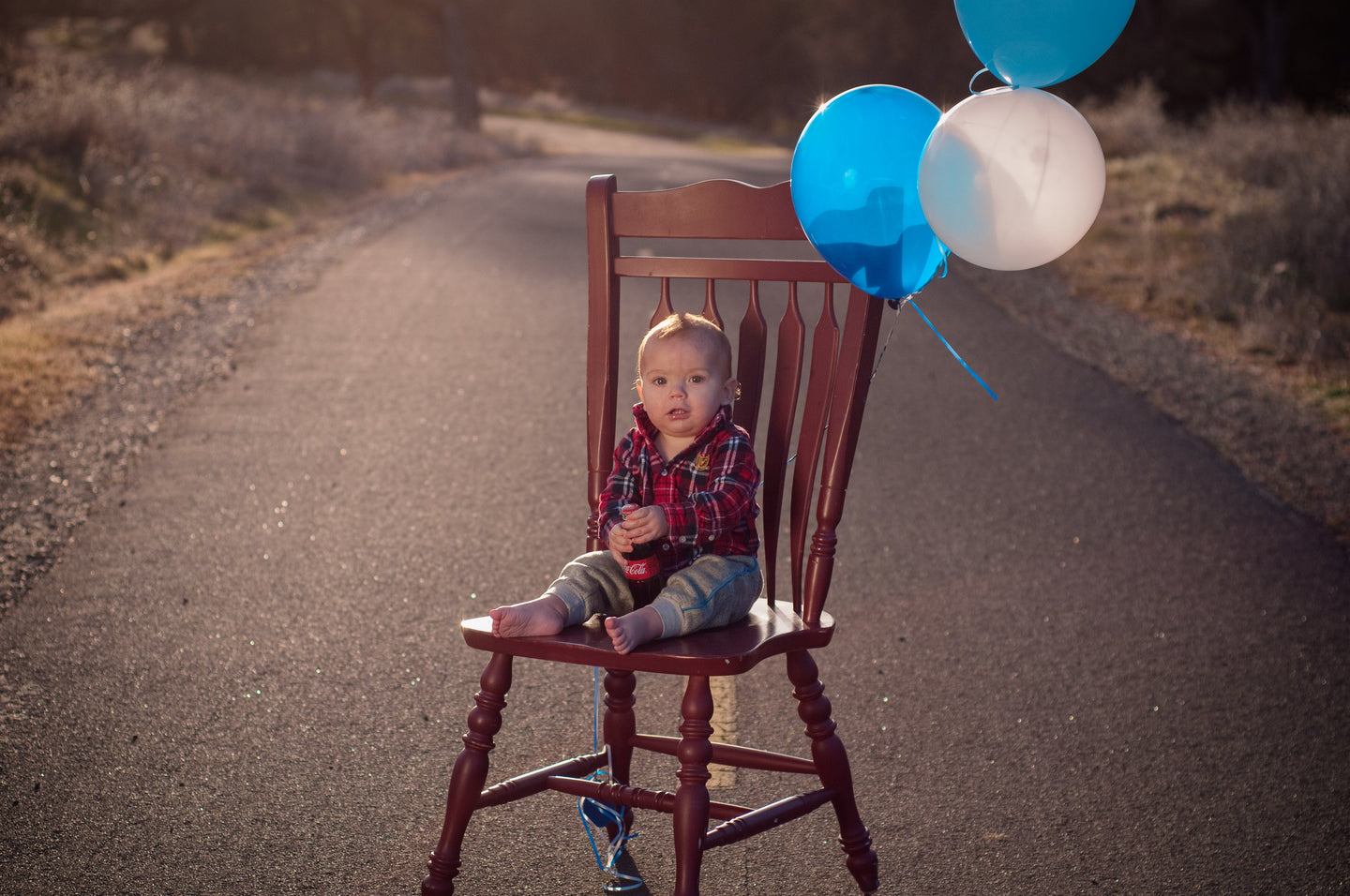 Birthday boy on a red chair Tracy McCrackin Photography - Tracy McCrackin Photography
